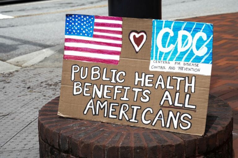 A sign sits on a lamp post, as community members come out to pay their respects for David Rose, an officer killed on August 8th, in Atlanta, Georgia, while stopping a gunman who was shooting at the Center of Disease Control and Prevention (CDC) in Atlanta, Georgia, on August 11, 2025.