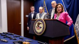 Seized guns are displayed as US Attorney for the District of Columbia Jeanine Pirro speaks during a news conference on August 26 in Washington, DC.