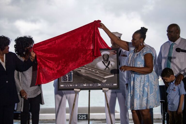 The family of Doris Miller unveil a plaque commemorating the future Navy ship, Ford-class aircraft carrier USS Doris Miller, at a Dr. Martin Luther King Jr. Day celebration event on Joint Base Pearl Harbor-Hickam, in January 2020.