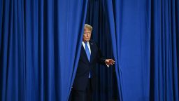 President Donald Trump arrives to deliver remarks at the Nassau County Police Academy Center for Training and Intelligence in Garden City, New York, on August 14.