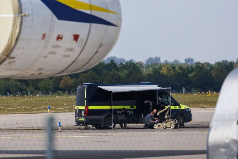 LEIPZIG, GERMANY - AUGUST 5: Police investigators work on the tarmac with a robot capable of defusing explosives near a  Ukrainian Antonov cargo plane at Leipzig/Halle Airport on August 5, 2026 near Leipzig, Germany. Airport workers reportedly discovered a drone yesterday on the tarmac near an Antonov at the airport that was equipped with an explosives detonator and an unidentified substance. Additionally, a DHL cargo plane that took off from the airport late last night collided with a small object, causing minor damage. (Photo by Jens Schlueter/Getty Images)