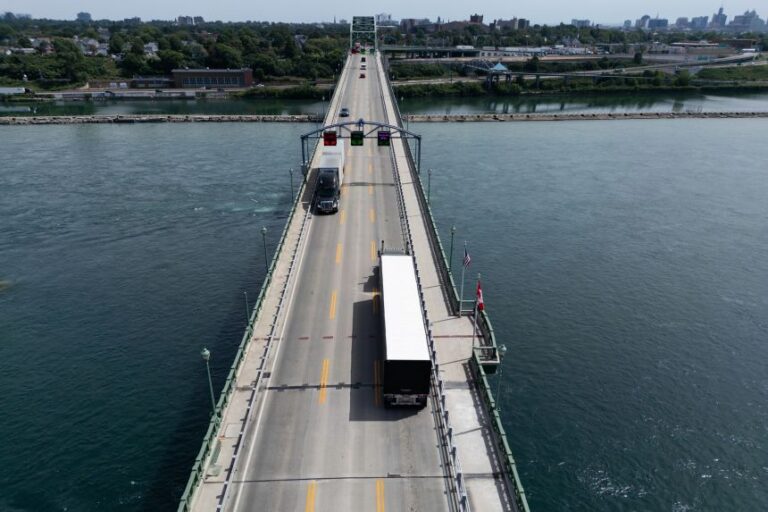Tractor trailers cross the Peace Bridge at the Canada-United States border in Fort Erie, Ontario, Canada, on August 20.