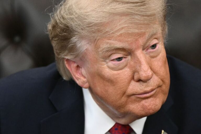 President Donald Trump looks on during an event in the Oval Office of the White House on Monday.