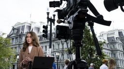 CNN Correspondent Julia Benbrook prepares for a television report on a street corner outside the White House grounds after earlier being denied entry, on September 19, 2026 in Washington, DC. Reporters from MS NOW, CNN and Politico were barred from the White House a day after President Trump said he was banning the three outlets from the property.
