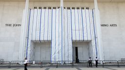 Security keeps watch at the main entrance to the John F. Kennedy Center for the Performing Arts on a day when the center's board voted to inscribe onto the building “Restored and Renovated by President Donald J. Trump”, in Washington, DC, on August 13, 2026.