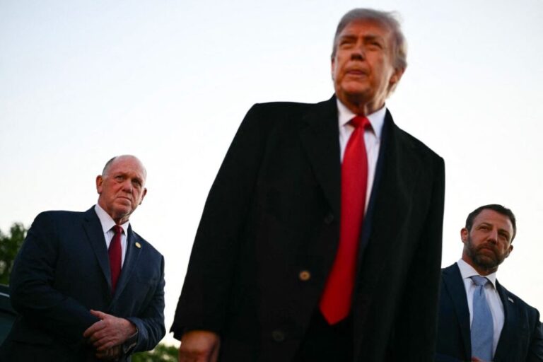 President Donald Trump, flanked by White House