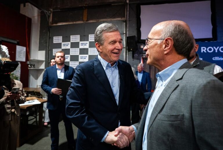 Roy Cooper, former governor of North Carolina and Democratic US Senate candidate for North Carolina, greets attendees during the