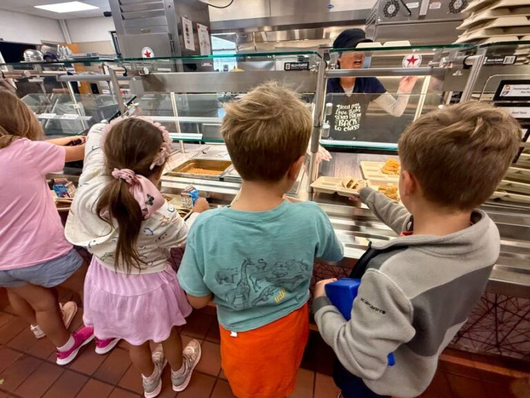 Second graders at Lenski Elementary School in Centennial, Colorado, line up for lunch service.
