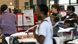 People walk past a polling place at the Martin Luther King Jr. Memorial Library in Washington, DC, during a primary election on June 16.