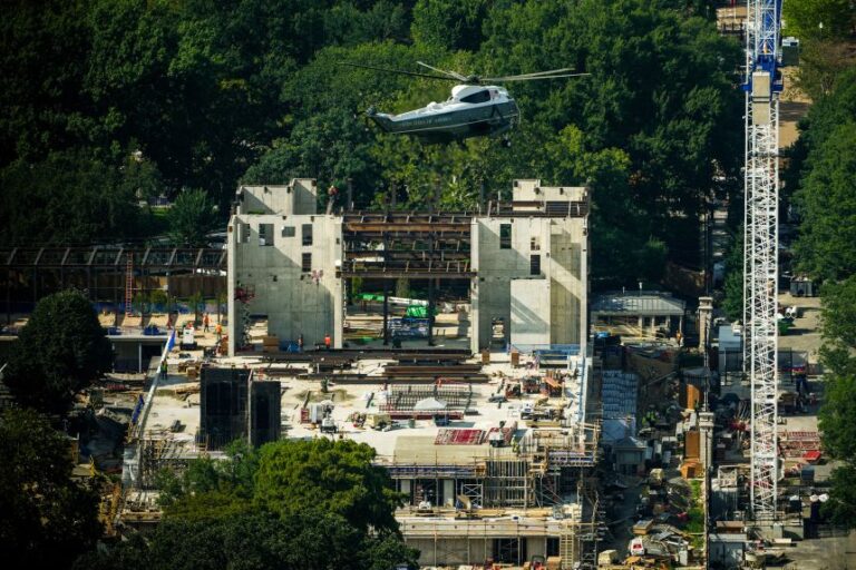Marine One carries President Donald Trump as it passes over construction on the new White House ballroom on August 21.