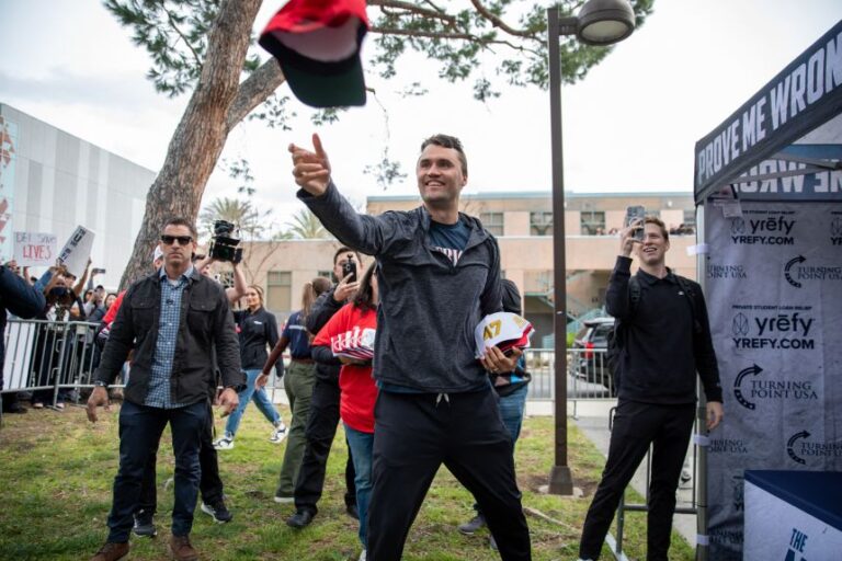 Charlie Kirk throws hats into the crowd during his American Comeback tour stop in Northridge, California, on March 6, 2025.