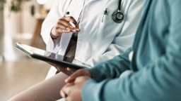 Tablet, hands and patient with doctor in hospital for consultation.