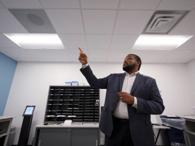 Derek Bowens points to a dedicated exhaust system to remove hazardous fumes from potentially contaminated packages in the organization’s mailroom, as he boosts security to fortify the building and protect staff in preparation for the upcoming midterm elections, in Durham, North Carolina, on August 31.