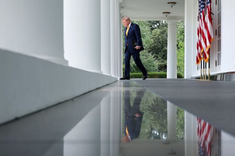 President Donald Trump walks from the Oval Office to the Rose Garden of the White House on August 24.