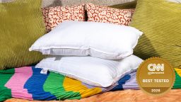 Two pillows stacked on couch.