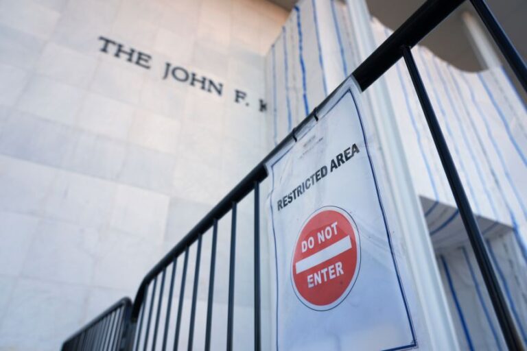 A sign is placed on a gate outside the John F. Kennedy Center for the Performing Arts in Washington, on September 15.