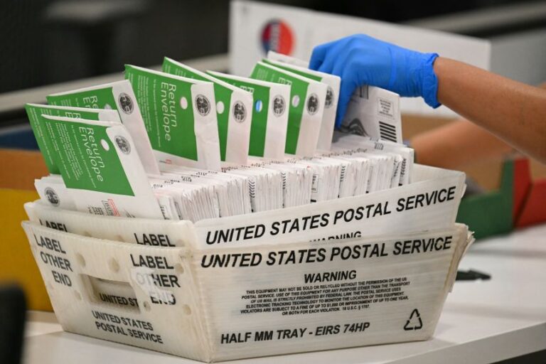An election worker processes mail-in ballots at the Los Angeles County Ballot Processing Center during California's state primary election in the City of Industry, California, on June 2.