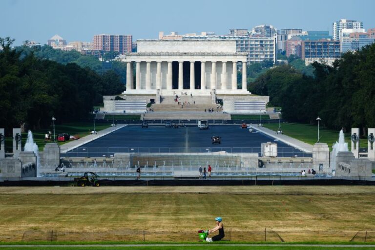Damaged grass is seen on the National Mall as work continues on the Lincoln Memorial Reflecting Pool, on Tuesday, Sept. 1.