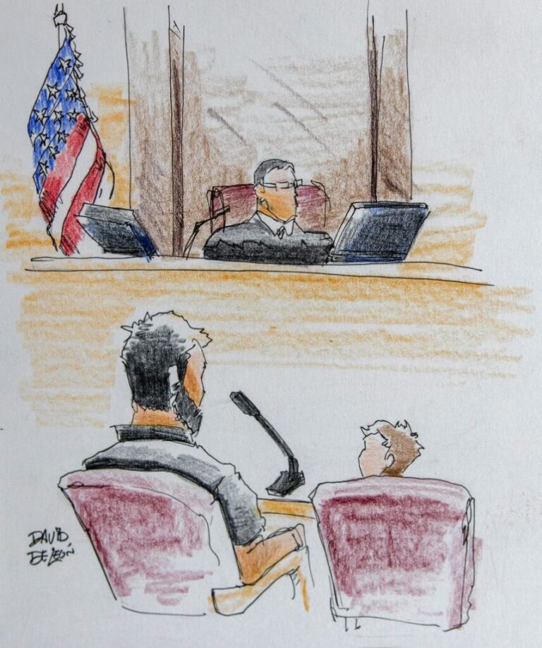 An unaccompanied migrant child sits before an immigration judge, with a caseworker who is there to supervise.