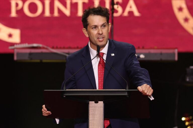 Tyler Bowyer speaks during the public memorial service for Charlie Kirk in Glendale, Arizona, on September 21, 2025.
