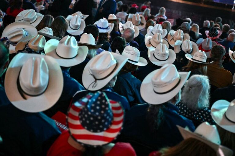 Attendees from Texas watch the proceedings during the second day of the Republican National Committee midterm convention at the American Airlines Center in Dallas on Thursday.