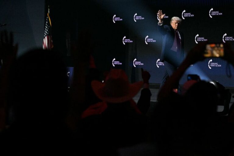 President Donald Trump waves as he leaves the stage after addressing a Turning Point USA event in Phoenix on April 17, 2026.