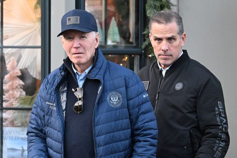 President Joe Biden, accompanied by his son Hunter Biden, walks out of a bookstore in downtown Nantucket, Massachusetts, on November 29, 2024.