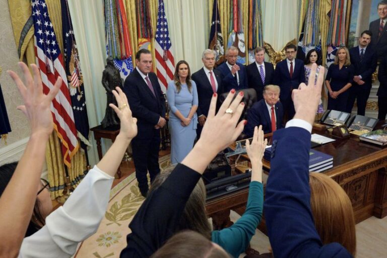 President Donald Trump takes questions from reporters during a healthcare event in the Oval Office at the White House on September 18.