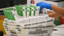 An election worker processes mail-in ballots at the Los Angeles County Ballot Processing Center during California's state primary election in the City of Industry, California, on June 2.