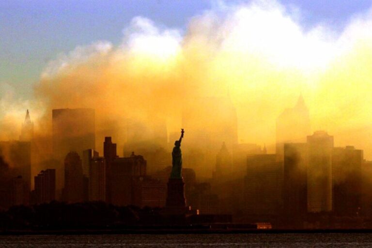 Smoke and dust fill the sky above Manhattan at dawn on September 15, 2001.