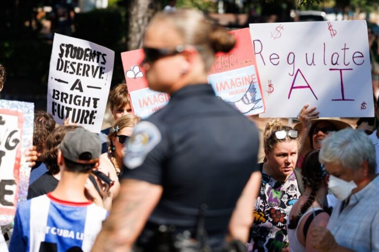 Demonstrators against AI hold signs during a protest outside the G20 Innovation Ministerial in Chapel Hill, North Carolina, on Septeber 2.