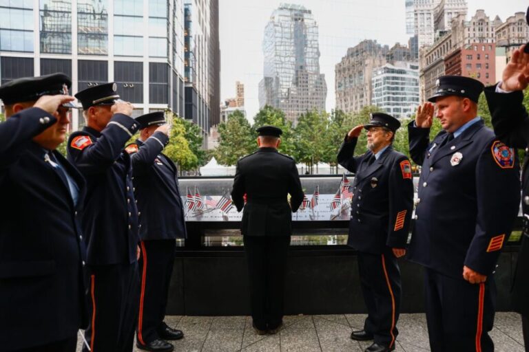 New York firefighters pay their respects at the memorial in New York.