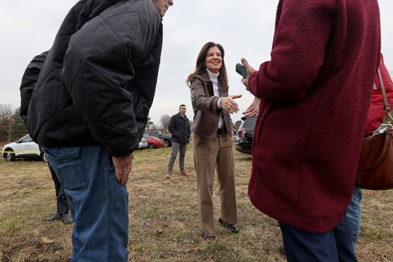 New Hampshire Governor Kelly Ayotte greets supporters as she attends a ceremonial ground breaking for a new housing development on November 21, 2025.