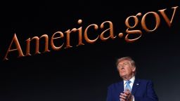 US President Donald Trump applauds on stage during the America.gov launch event at Andrew W. Mellon Auditorium on September 29 in Washington, DC.