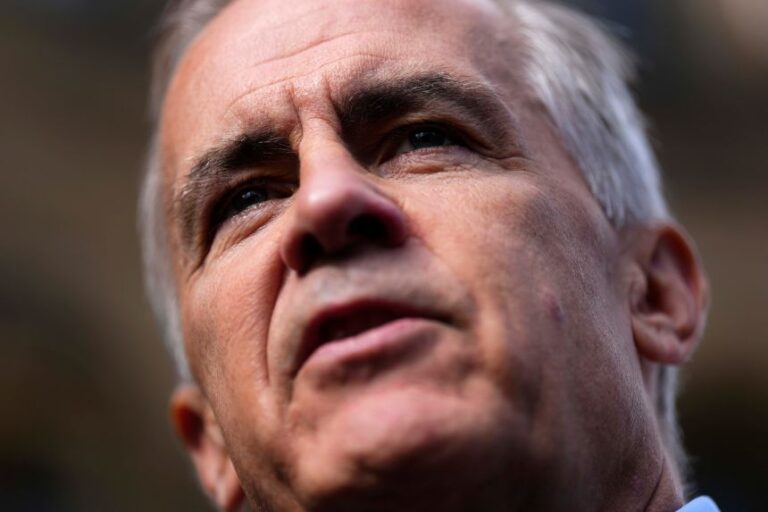 Prime Minister Mark Carney speaks to journalists as he arrives at the Office of the Prime Minister and Privy Council in Ottawa, Canada, on Tuesday.
