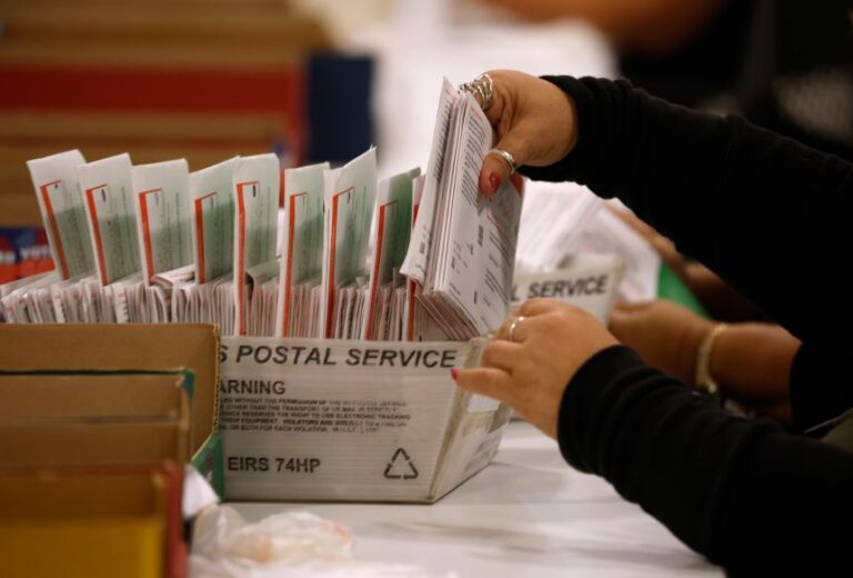 An election worker processes mail-in ballots for the California state primary election at the Los Angeles County Ballot Processing Center in City of Industry, California, on June 5.