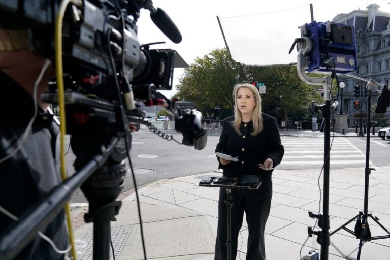 CNN Senior White House Reporter Betsy Klein, holding an empty credential holder, reports near the White House complex after having her credential confiscated following President Donald Trump's ban on CNN, MS NOW and Politico, Saturday, Sept. 19, 2026, in Washington, DC.