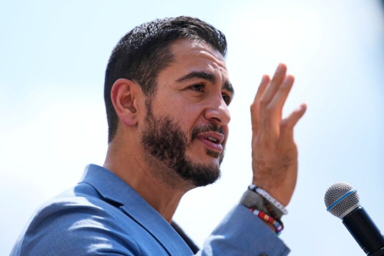 Abdul El-Sayed speaks at a news conference at the base of the Spirit of Detroit monument in Detroit, on August 19.