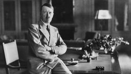 Nazi leader Adolf Hitler (1889 - 1945), sitting on the edge of a desk at his Berghof residence, Berchtesgaden, Bavaria, Germany, during World War II, circa 1940. (Photo by Paul Popper/Popperfoto via Getty Images/Getty Images)