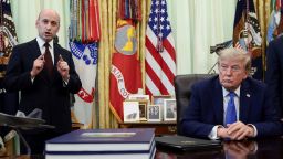 White House Deputy Chief of Staff Stephen Miller speaks while President Donald Trump listens during an event to sign executive orders in the Oval Office of the White House, on August 6, 2026.