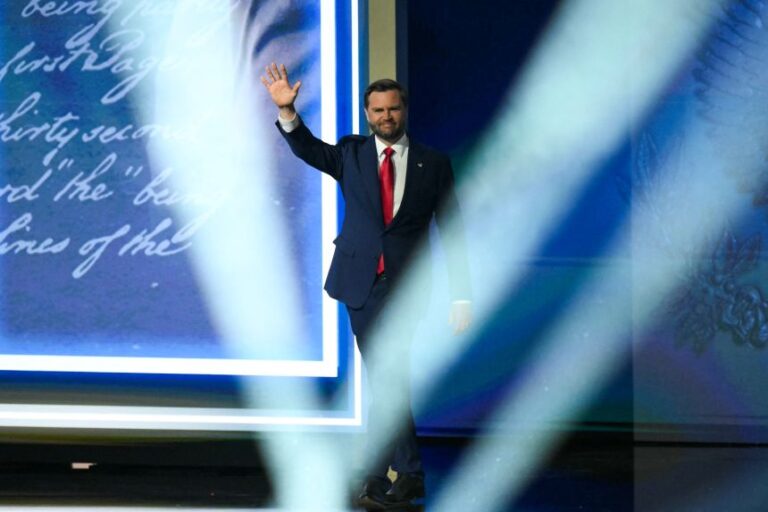 Vance arrives onstage to speak during the second day of the Republican National Committee midterm convention  in Dallas, on Thursday.