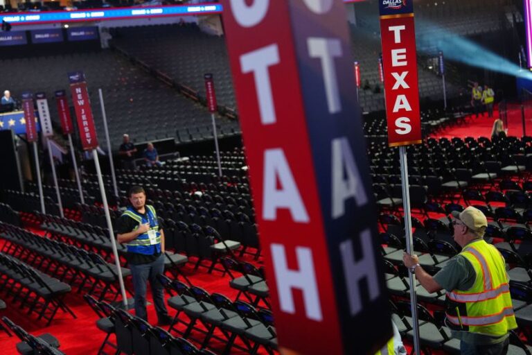 Workers prepare the arena in Dallas on Tuesday.
