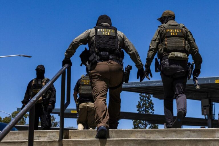 Immigration and Customs Enforcement agents walk outside the Ventura County Government Center in Ventura, California, on July 27.