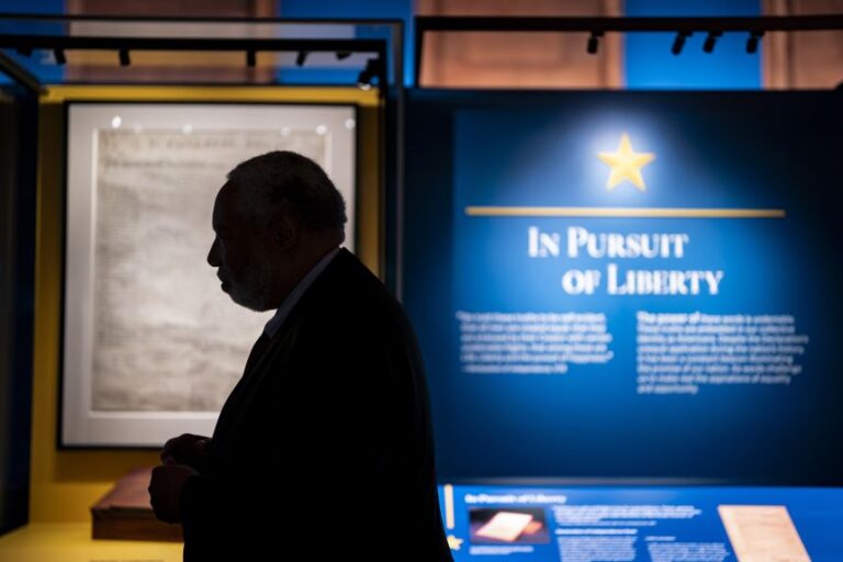 Lonnie Bunch III, the 14th secretary of the Smithsonian Institution, speaks near the mahogany desk that former President Thomas Jefferson used to sign the Declaration of Independence in 1776, ahead of the opening of the