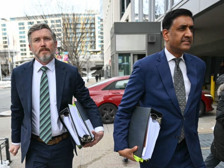 Rep. Thomas Massie and Rep. Ro Khanna arrive at a Department of Justice office in Washington, DC, on February 9, to review unredacted Jeffrey Epstein files on Department of Justice computers.