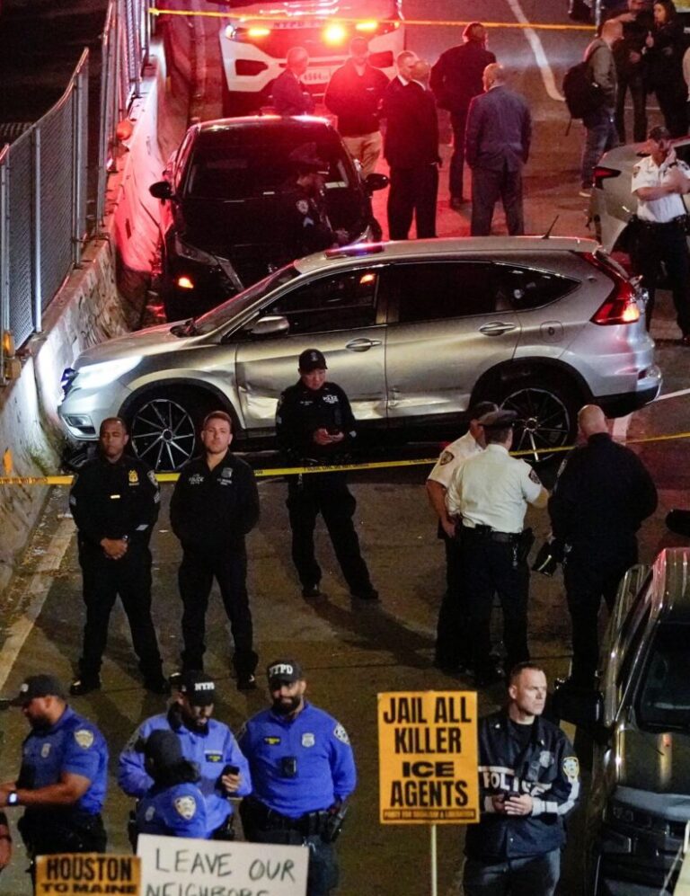 Law enforcement gather near a damaged vehicle at the scene after a shooting reportedly involving US Immigration and Customs Enforcement officers in the Bronx borough of New York on October 8.