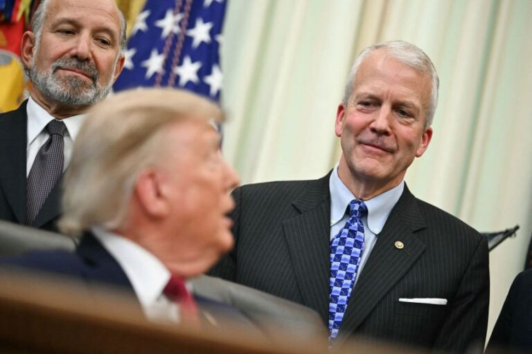US President Donald Trump speaks to US Senator Dan Sullivan of Alaska as he makes an announcement with US Secretary of Commerce Howard Lutnick in the Oval Office of the White House in Washington, DC, on September 30.