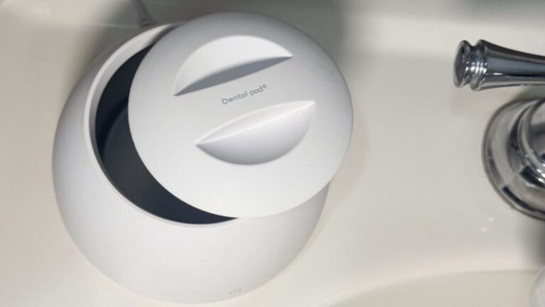 Zima Dental Pod on bathroom sink.