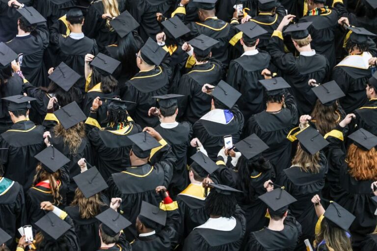 Graduates celebrate their commencement during Towson University's winter ceremony in Towson, Maryland, on December 17, 2025.