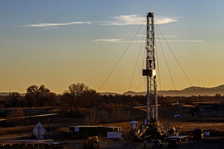 An oil drilling rig is seen northeast of Denver in Lochbuie, Colorado.